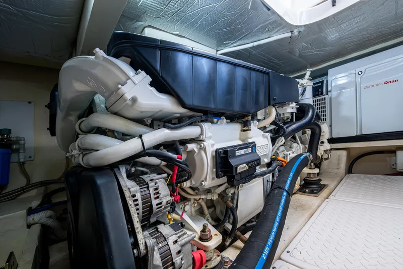 Hwyl Fawr Yacht Photos Pics Engine room of 2018 Tiara Yachts F53 Flybridge, showcasing detailed mechanical components.