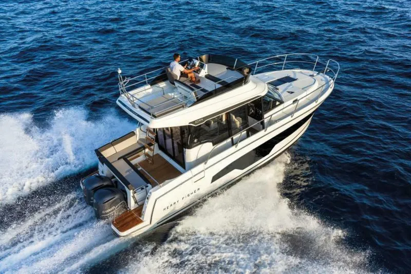  Yacht Photos Pics 2025 Jeanneau NC 1095 Fly cruising on open water, showcasing sleek design and powerful engines.