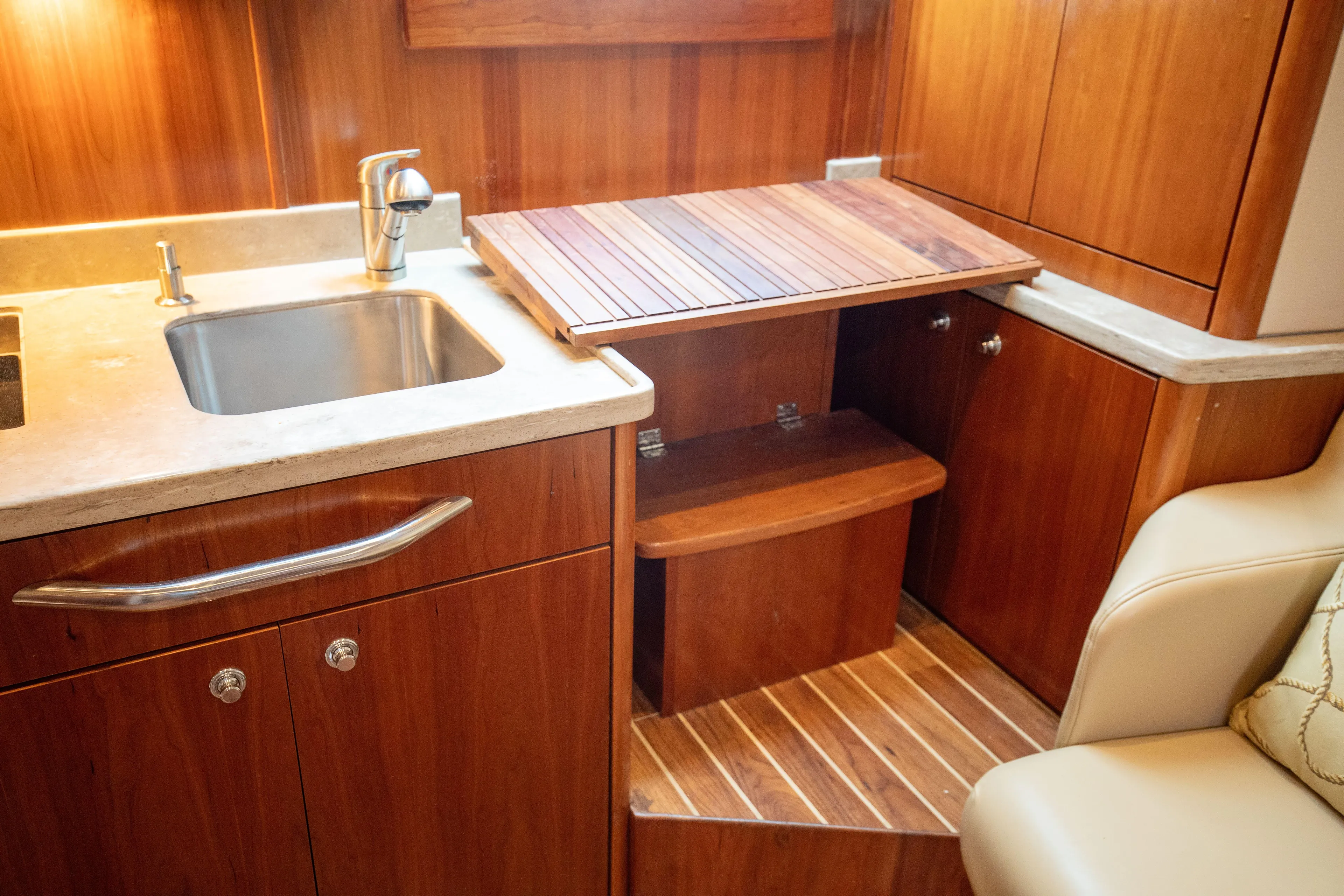Moana Here Yacht Photos Pics 2015 Albemarle 360 Express Fisherman interior with wooden cabinetry and sink.