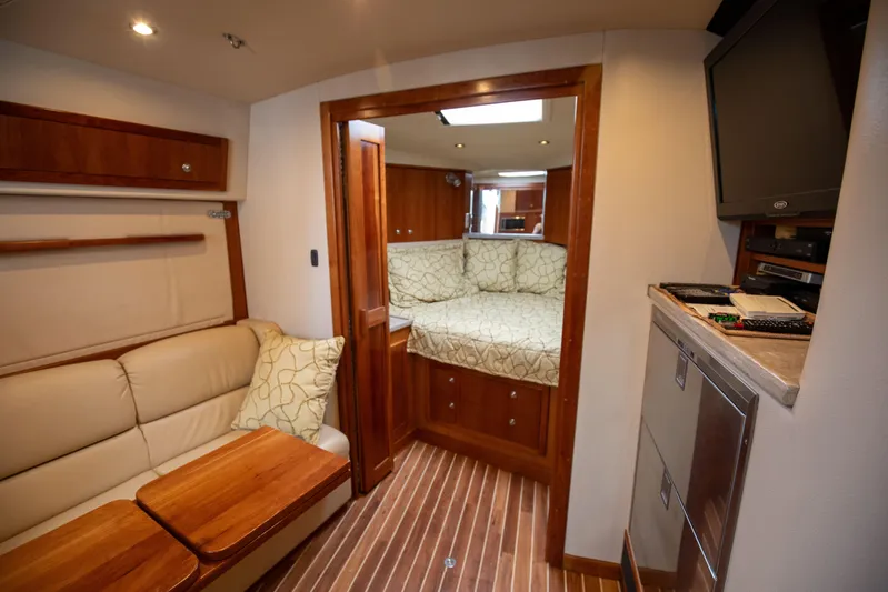 Moana Here Yacht Photos Pics Interior of 2015 Albemarle 360 Express Fisherman with cozy seating and wood accents.