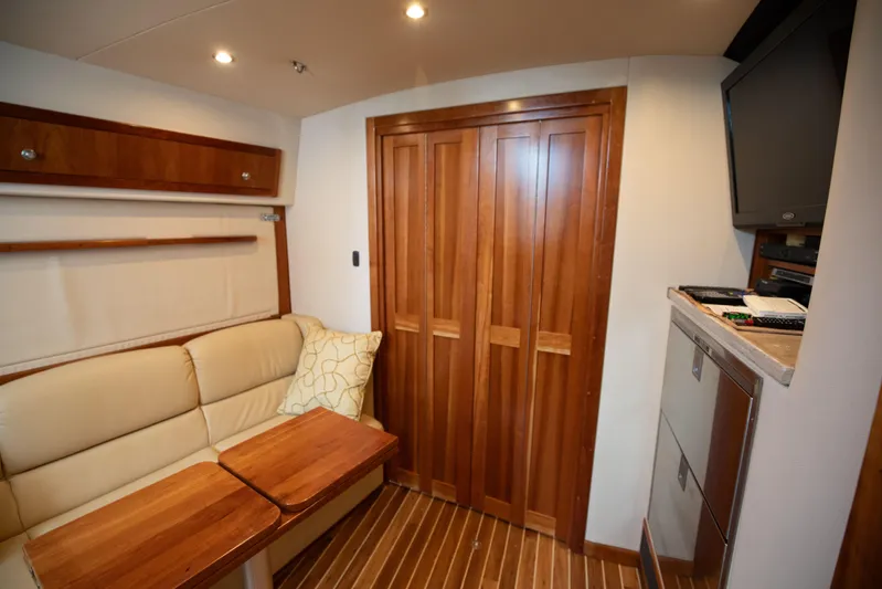 Moana Here Yacht Photos Pics 2015 Albemarle 360 Express Fisherman cabin with wood accents and cozy seating area.