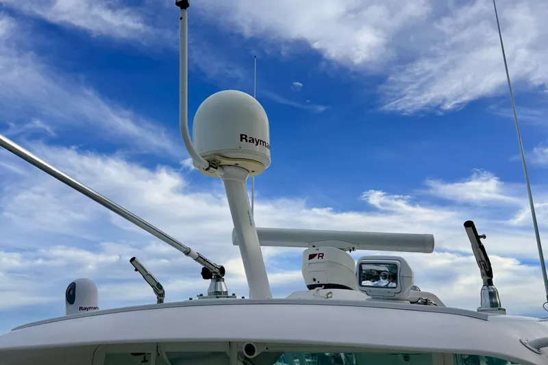 Moana Here Yacht Photos Pics Radar and antennas on 2015 Albemarle 360 Express Fisherman against blue sky.