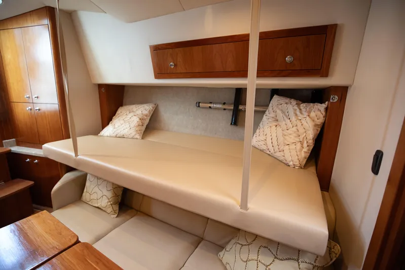 Moana Here Yacht Photos Pics 2015 Albemarle 360 Express Fisherman cabin interior with seating and storage.