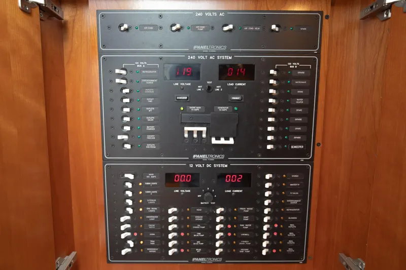 Moana Here Yacht Photos Pics Electrical panel of a 2015 Albemarle 360 Express Fisherman boat, featuring AC and DC systems.