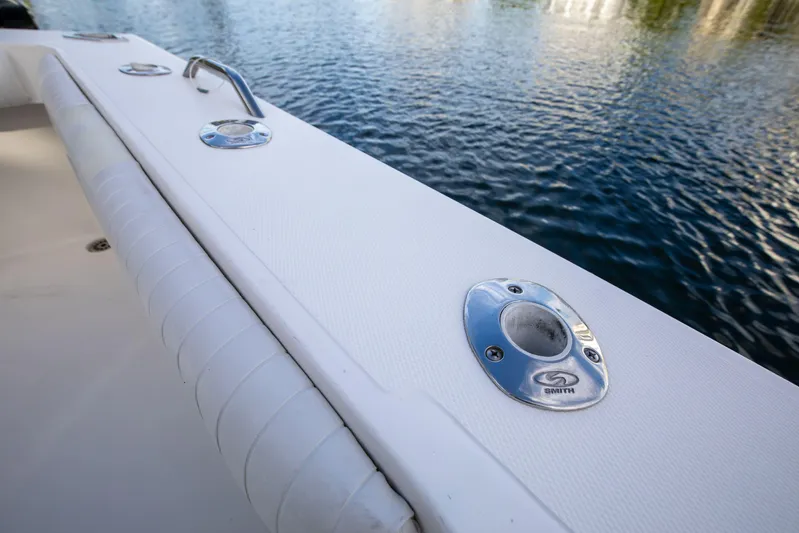 Moana Here Yacht Photos Pics 2015 Albemarle 360 Express Fisherman boat deck with rod holders by the water.