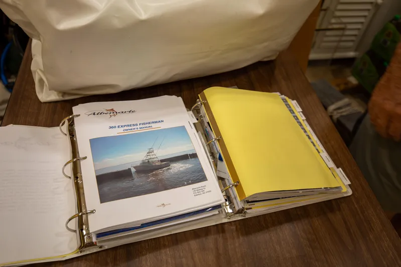 Moana Here Yacht Photos Pics Owner's manual for 2015 Albemarle 360 Express Fisherman on a wooden table.