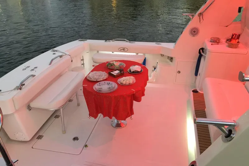 Moana Here Yacht Photos Pics 2015 Albemarle 360 Express Fisherman boat with a red tablecloth dining setup.