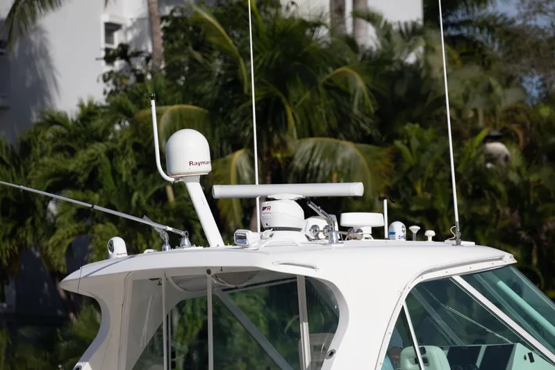 Moana Here Yacht Photos Pics 2015 Albemarle 360 Express Fisherman boat with radar equipment, surrounded by lush greenery.