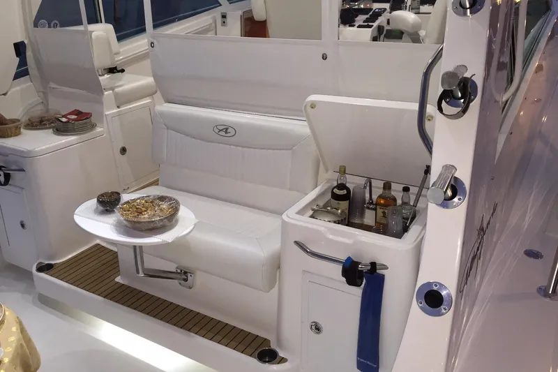 Moana Here Yacht Photos Pics 2015 Albemarle 360 Express Fisherman interior with seating and built-in bar.