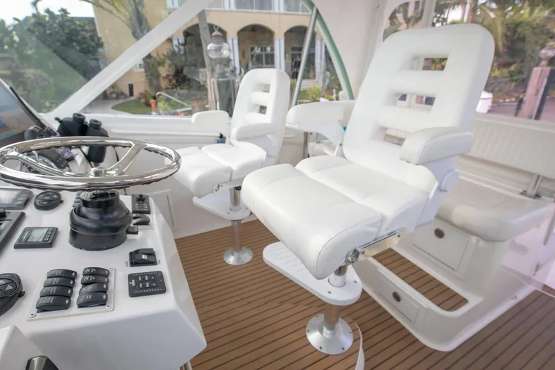 Moana Here Yacht Photos Pics 2015 Albemarle 360 Express Fisherman helm with white captain chairs and control panel.