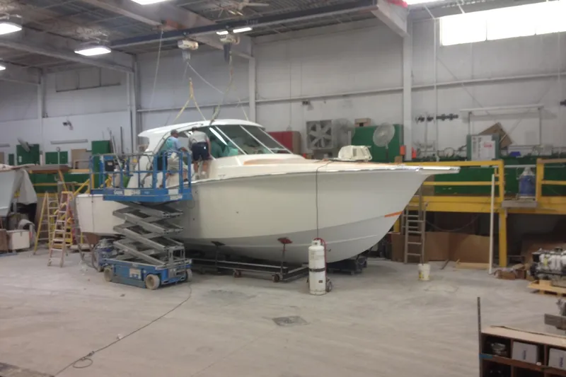 Moana Here Yacht Photos Pics 2015 Albemarle 360 Express Fisherman boat under maintenance in a workshop.