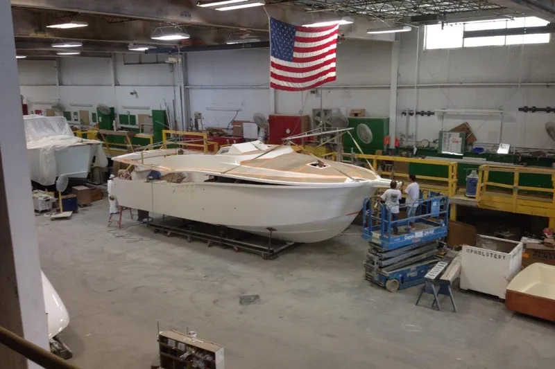 Moana Here Yacht Photos Pics 2015 Albemarle 360 Express Fisherman under construction in a workshop with American flag.