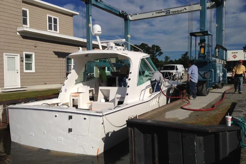 Moana Here Yacht Photos Pics 2015 Albemarle 360 Express Fisherman boat at dockside with crew and equipment.