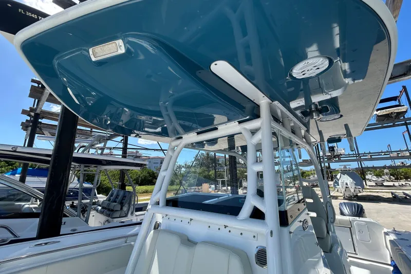  Yacht Photos Pics 2022 Cape Horn 36 boat with blue T-top and white frame in a marina setting.