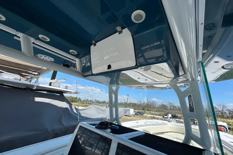  Yacht Photos Pics Interior view of a 2022 Cape Horn 36 boat, showcasing the helm and overhead compartments.