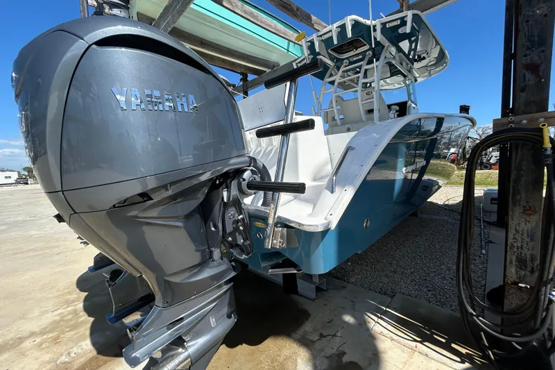  Yacht Photos Pics 2022 Cape Horn 36 boat with Yamaha outboard motor, docked under clear blue sky.