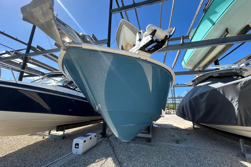  Yacht Photos Pics 2022 Cape Horn 36 boat in storage, blue hull, sunny day, surrounded by other boats.