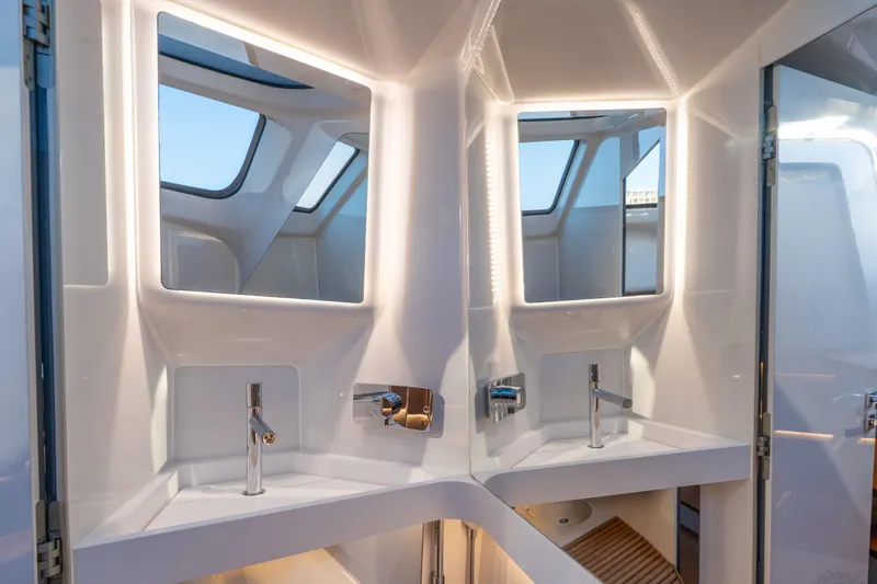 Acdc Yacht Photos Pics Luxurious bathroom interior of 2019 Frauscher 1414 Demon Air yacht, featuring modern fixtures.