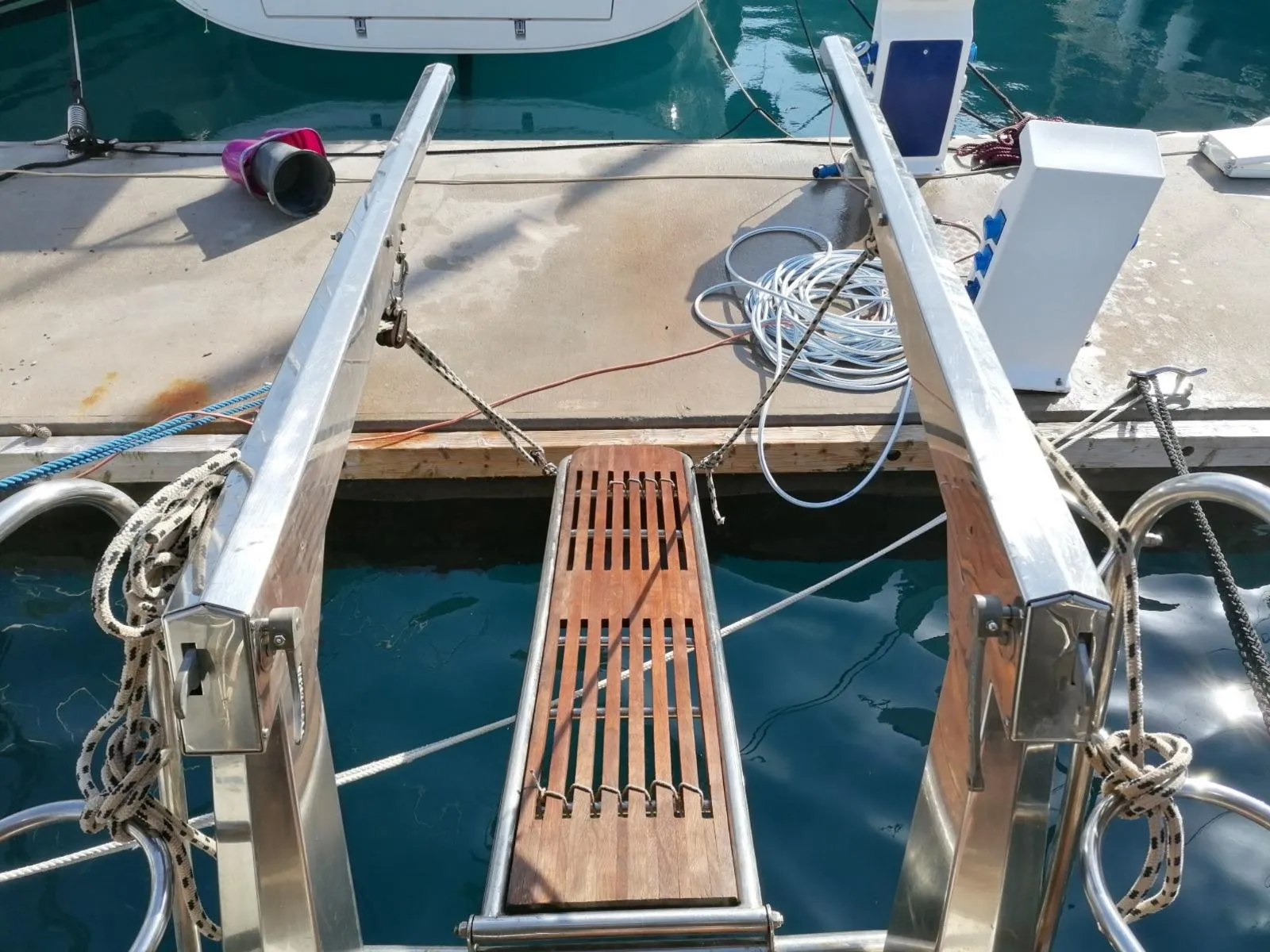 Boarding plank of 1973 Sloop Beaufort 14 Bluewater Cruiser at dock.