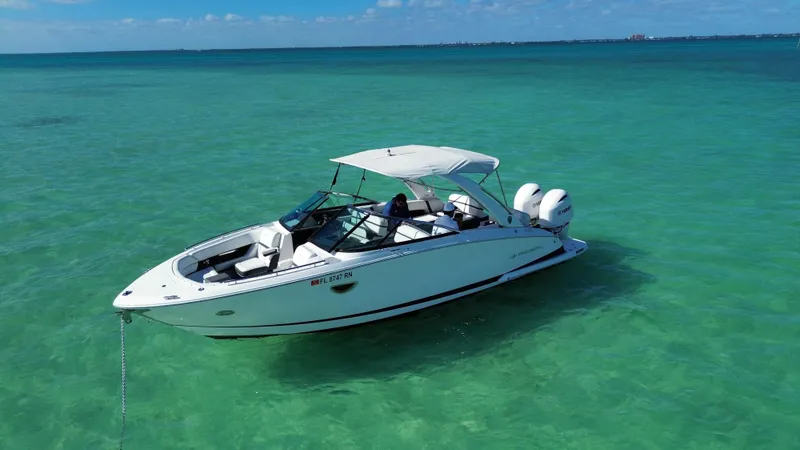  Yacht Photos Pics 2018 Regal 29 OBX boat on clear turquoise water.