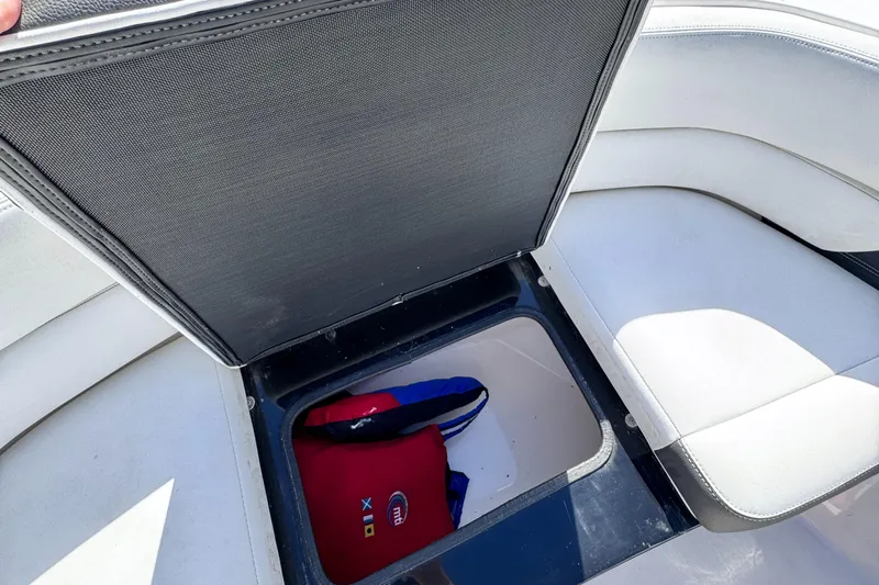  Yacht Photos Pics 2018 Regal 29 OBX boat storage compartment with life jacket inside.
