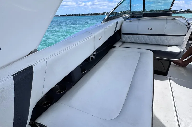  Yacht Photos Pics 2018 Regal 29 OBX boat interior with white seating and ocean view.