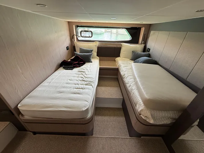 Relax Josephine Yacht Photos Pics Luxurious cabin interior of 2022 Azimut Atlantis 45 yacht with twin beds and modern decor.