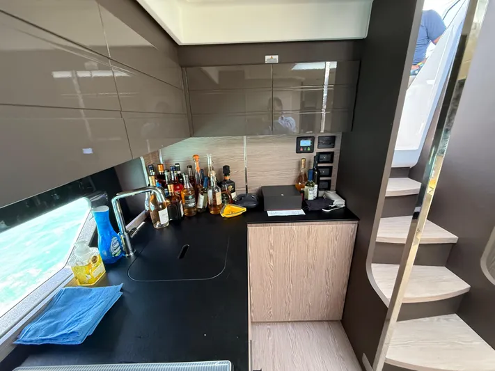 Relax Josephine Yacht Photos Pics Modern kitchen interior of 2022 Azimut Atlantis 45 yacht with sleek cabinetry and countertop.