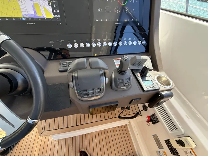 Relax Josephine Yacht Photos Pics Control panel of 2022 Azimut Atlantis 45 yacht with navigation and steering systems.