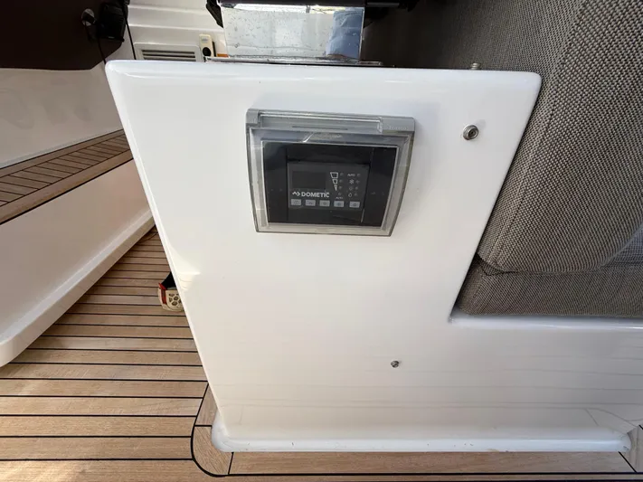 Relax Josephine Yacht Photos Pics Azimut Atlantis 45 yacht interior control panel, 2022 model, with sleek wooden flooring.
