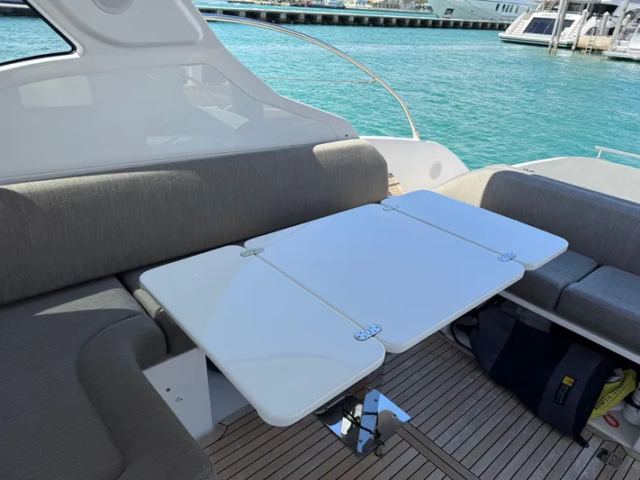 Relax Josephine Yacht Photos Pics Azimut Atlantis 45 yacht interior, 2022 model, featuring a sleek dining area with a foldable table.