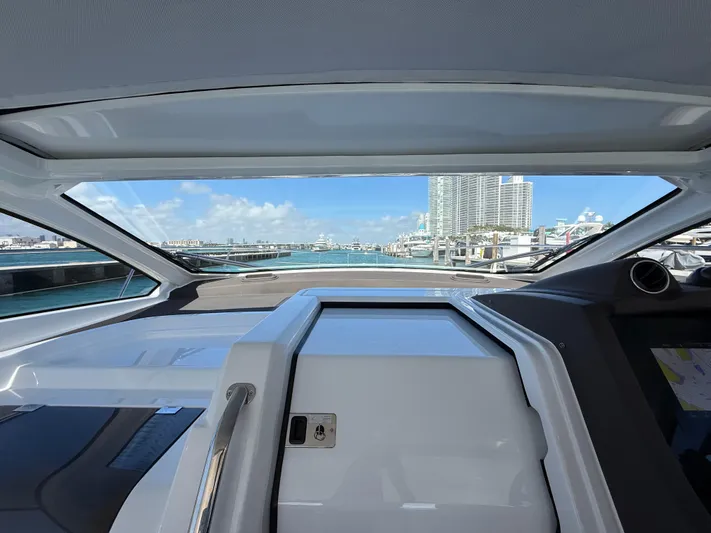 Relax Josephine Yacht Photos Pics 2022 Azimut Atlantis 45 yacht interior with marina view through large windows.