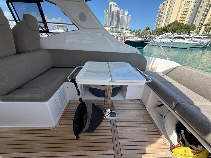 Relax Josephine Yacht Photos Pics Azimut Atlantis 45 yacht interior, 2022 model, featuring a sleek seating area and table.