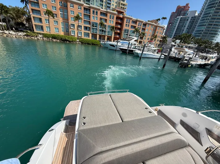 Relax Josephine Yacht Photos Pics Azimut Atlantis 45 yacht, 2022 model, docked in a marina with waterfront buildings.