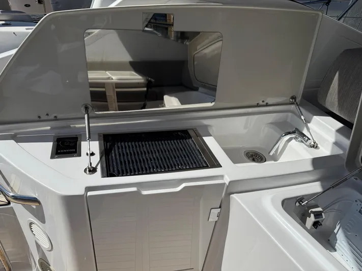 Relax Josephine Yacht Photos Pics Azimut Atlantis 45 yacht 2022, featuring a sleek outdoor kitchen with grill and sink.