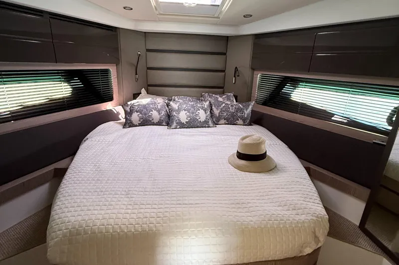Relax Josephine Yacht Photos Pics Luxurious bedroom interior of 2022 Azimut Atlantis 45 yacht with elegant bedding and decor.