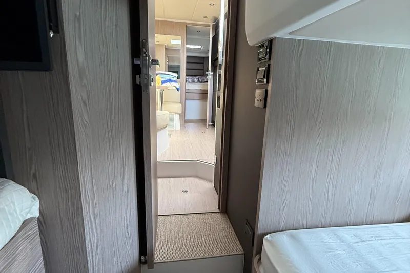 Relax Josephine Yacht Photos Pics Interior view of 2022 Azimut Atlantis 45 yacht cabin, featuring modern design and wood paneling.