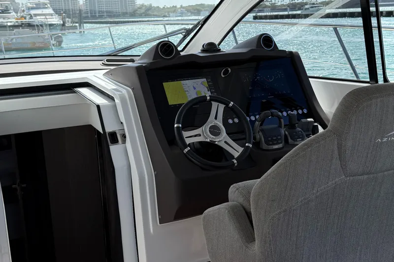 Relax Josephine Yacht Photos Pics Helm of 2022 Azimut Atlantis 45 yacht with modern navigation controls.
