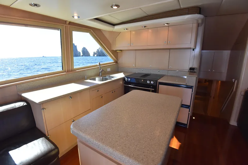 Talisman Yacht Photos Pics Interior of 1989 Striker 62 Convertible yacht with modern kitchen.