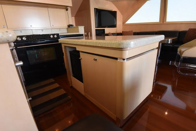 Talisman Yacht Photos Pics Interior of 1989 Striker 62 Convertible yacht kitchen area.