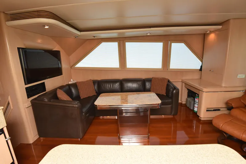 Talisman Yacht Photos Pics Luxurious salon of the 1989 Striker 62 Convertible yacht.