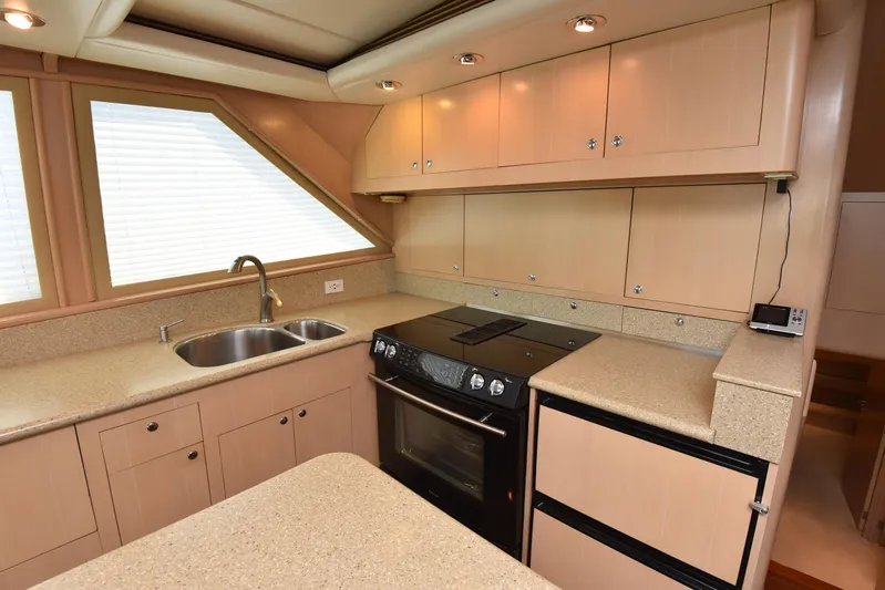 Talisman Yacht Photos Pics Kitchen area of 1989 Striker 62 Convertible yacht.