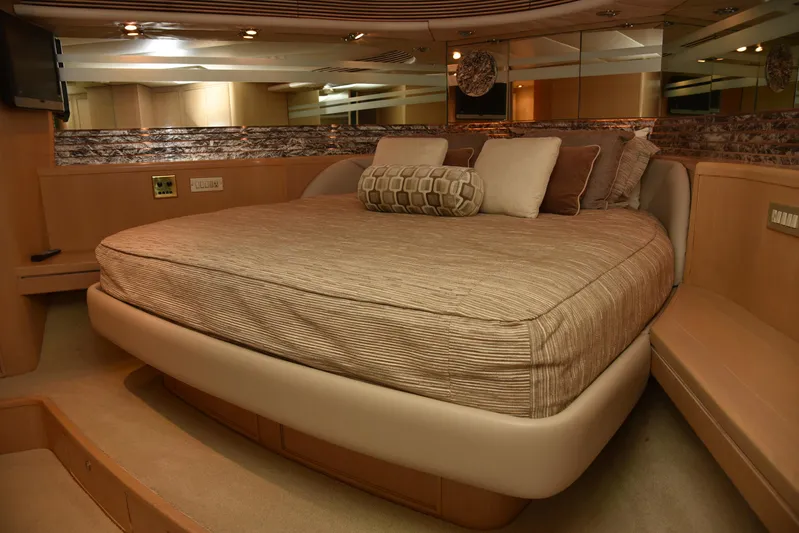 Talisman Yacht Photos Pics Luxurious bedroom in 1989 Striker 62 Convertible yacht.