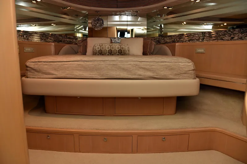 Talisman Yacht Photos Pics Luxurious bedroom in Striker 62 Convertible yacht, 1989 model.