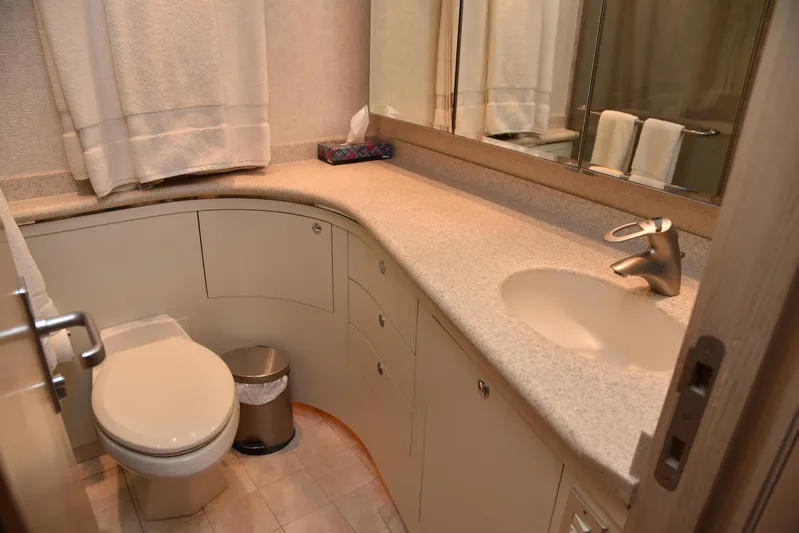 Talisman Yacht Photos Pics Bathroom in 1989 Striker 62 Convertible with sink and toilet.