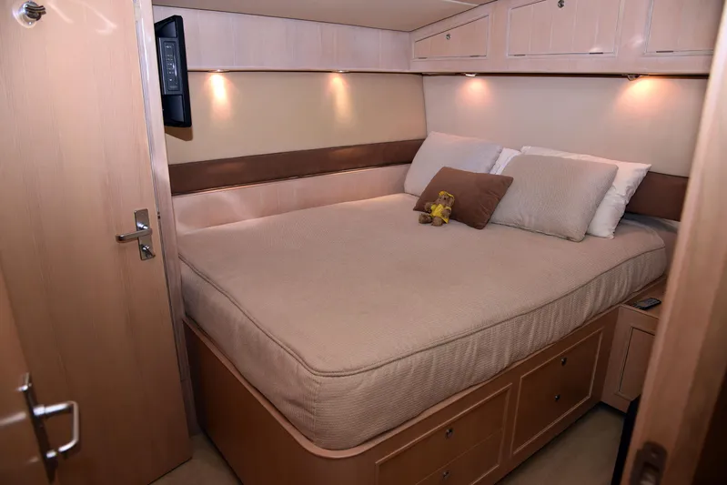 Talisman Yacht Photos Pics Interior of Striker 62 Convertible yacht, bedroom view.
