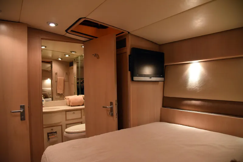 Talisman Yacht Photos Pics Interior of 1989 Striker 62 Convertible yacht bedroom and bathroom.