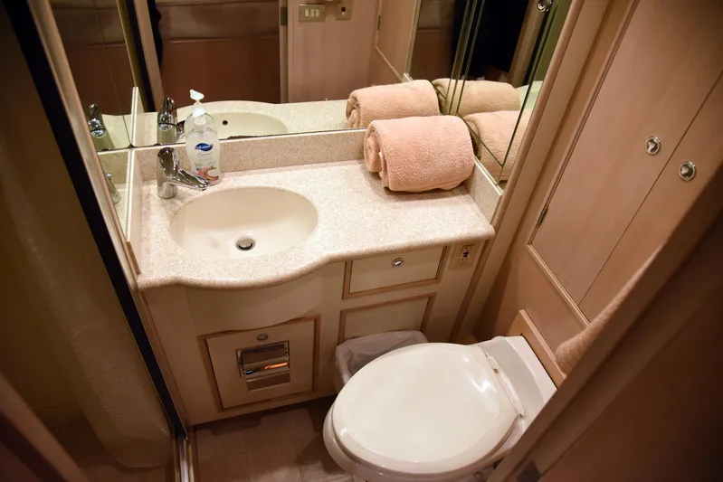 Talisman Yacht Photos Pics Bathroom in 1989 Striker 62 Convertible with sink and toilet.