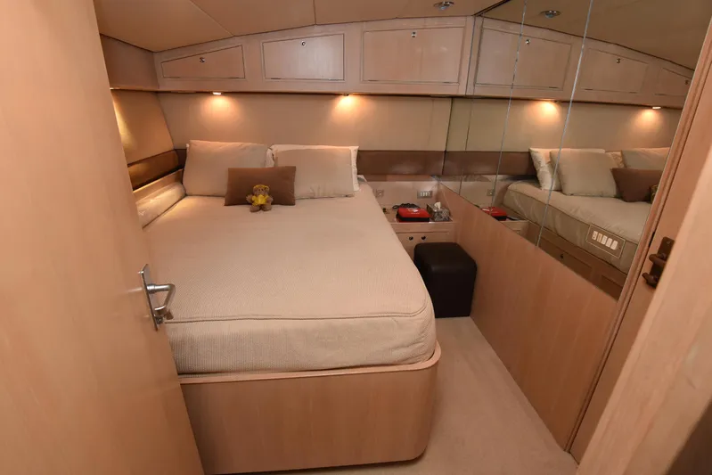 Talisman Yacht Photos Pics Luxurious bedroom on a 1989 Striker 62 Convertible yacht.