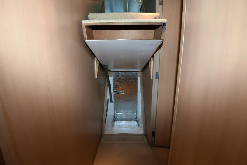 Talisman Yacht Photos Pics Interior of a 1989 Striker 62 Convertible, narrow corridor view.